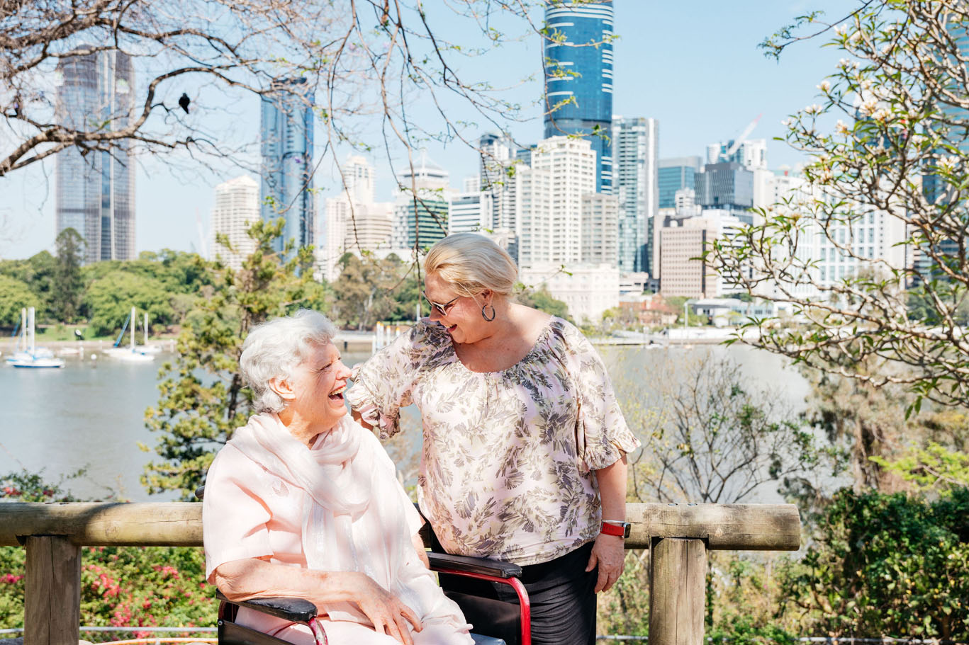 a carer with a lady in a wheelchair