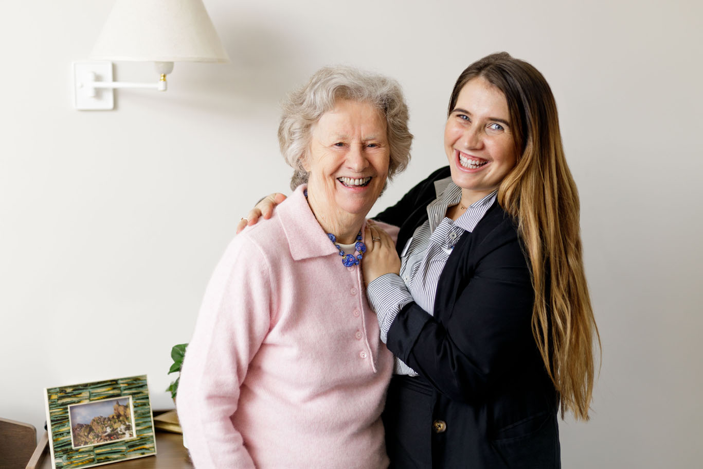 hawthorn aged care resident and staff member laughing in resident bedroom