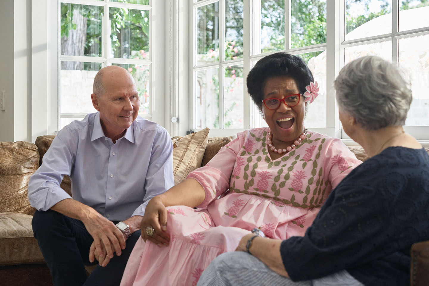 brian and etta sitting on the couch with margaret