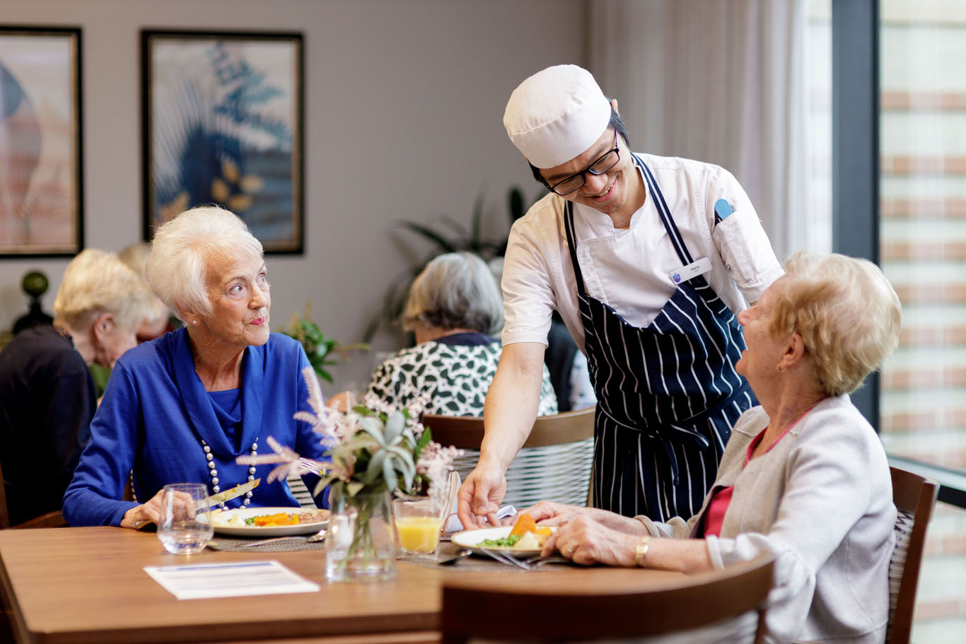 an aged care chef serving residents at st vincent's kew